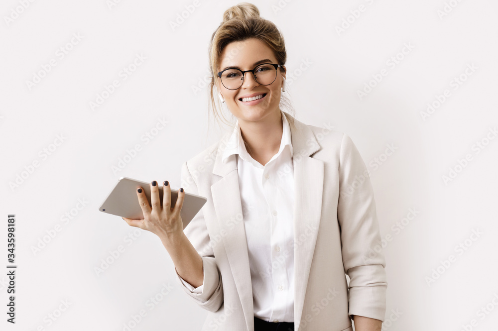 Businesswoman with a tablet pc on gray background Businesswoman with a tablet pc on gray background