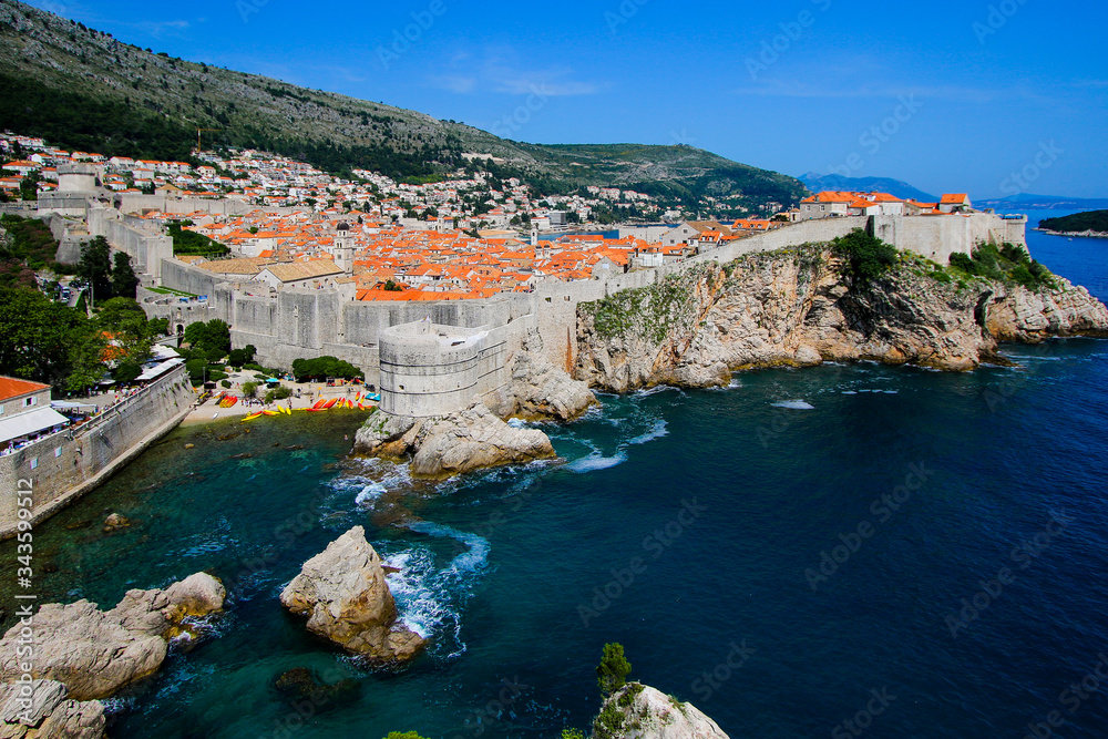 Fort Bokar along the walls of Dubrovnik's medieval old city in Croatia - Famous filming location of Kolorina beach on the Adriatic coast - Stone walls over a rocky shoreline in Europe