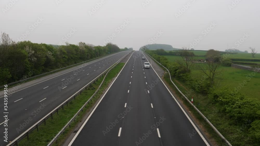 4K: Empty Deserted UK motorway with virtually no traffic during Lockdown for COVID-19 Coronavirus. Stock Video Clip Footage 4K: Empty Deserted UK motorway with virtually no traffic during Lockdown for COVID-19 Coronavirus. Stock Video Clip Footage