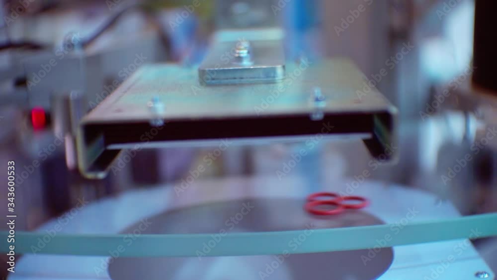 small details move quickly on a transparent conveyor small details move quickly on a transparent conveyor