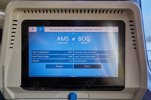 Slika na platnu Passenger flight seatback srceen showing detailed flight information on a transatlantic trip from Amsterdam to Bogota