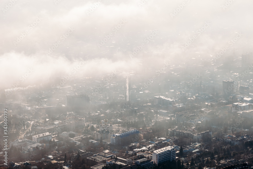 Fototapeta premium aerial view of the city through the clouds