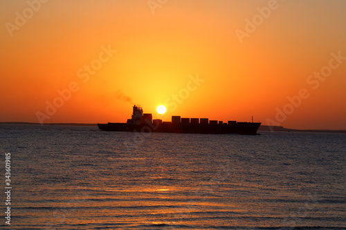 ship on the background of the Golden sunrise