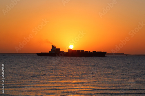 ship on the background of the Golden sunrise