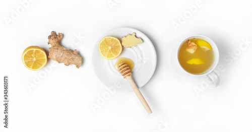 Tea with ginger, lemon and honey on a white isolated background