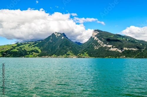 Thunersee (Thuner see), lake of Thun. View on alps mountains Burgfeldstand and Sigriswiler Rothorn and village Merligen. Faulensee nearby Spiez, Canton Bern, Switzerland