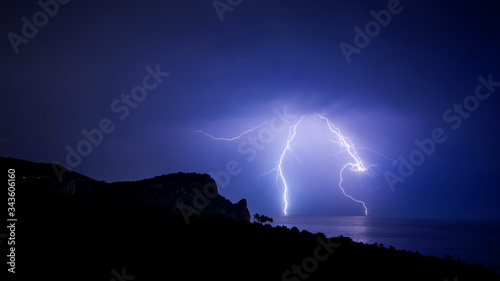 Complex shape lightning over The black sea coast in Crimea, panoramic