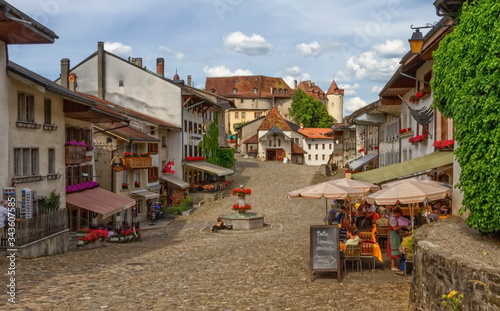 Main street in Gruyere village in Fribourg canton by beautiful day, Switzerland © Elenarts