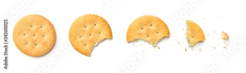 Steps of cracker being devoured. Isolated on white background.