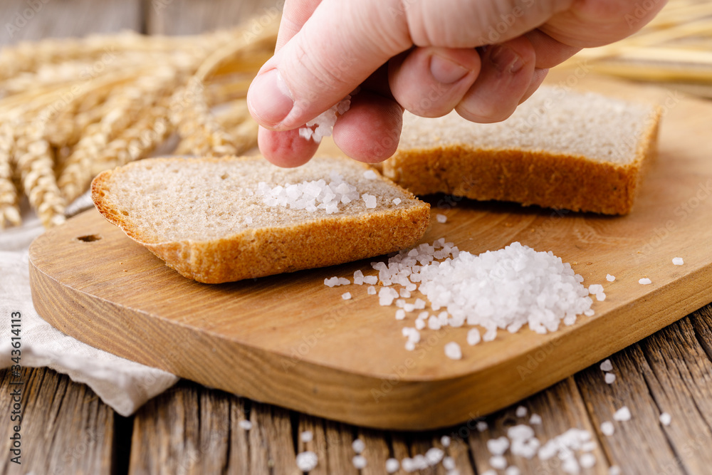 Freshly baked sliced rye bread on wooden cutting board Freshly baked sliced rye bread on wooden cutting board