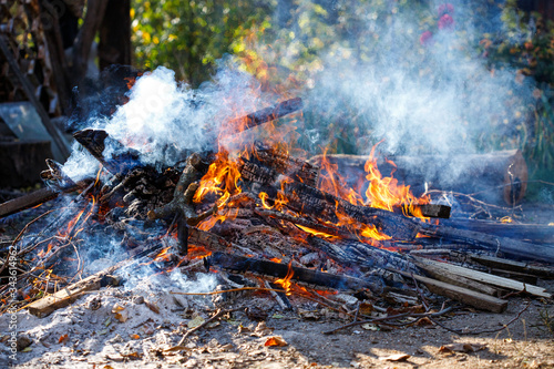 Large smoky bonfire in the garden.