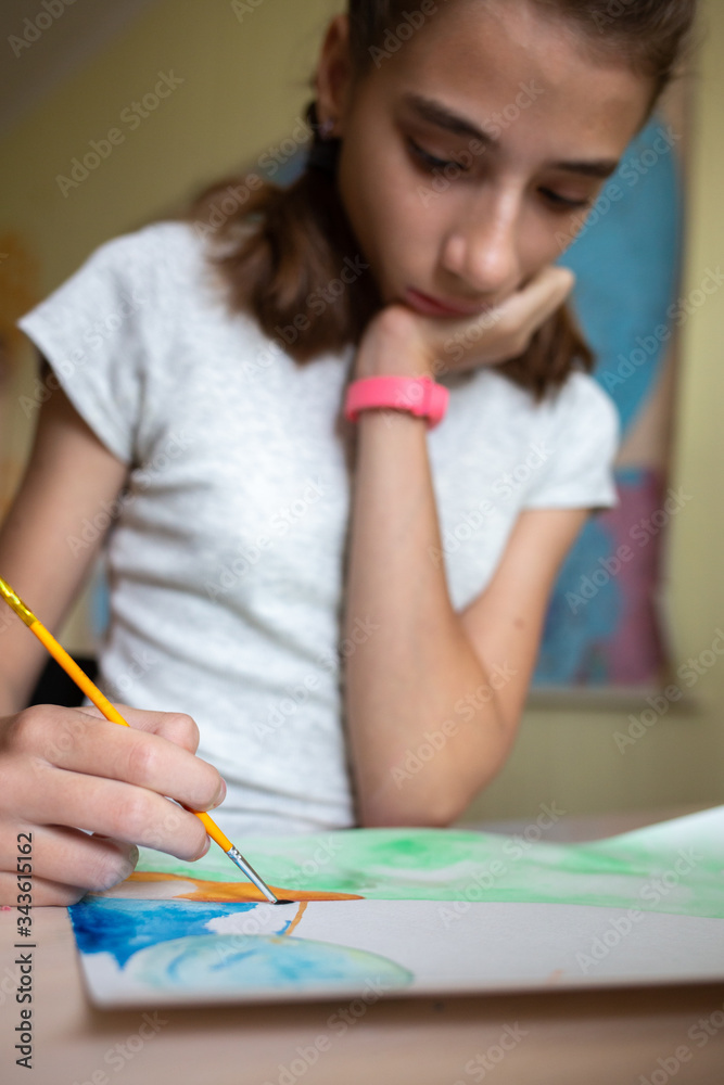 Young girl drawing with watercolors at home Young girl drawing with watercolors at home
