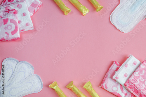 frame with pink background and feminine supplies