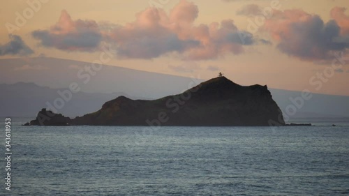 early morning sunrise alau island and the big island in view, taken in hana, maui photo