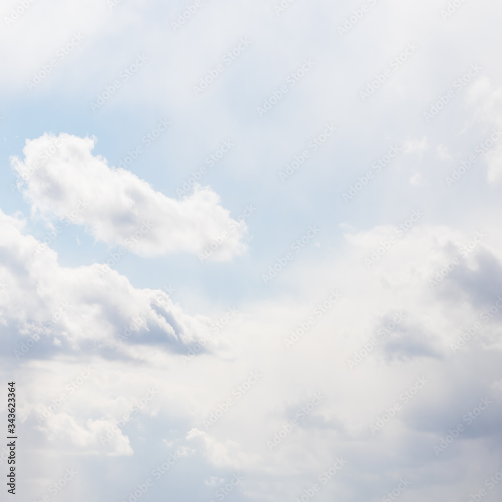 Light pale soft sky with delicate white clouds