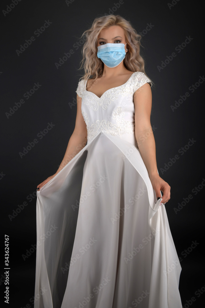 Bride with antiviral mask on her face. Covid-19 protects. Bride with antiviral mask on her face. Covid-19 protects.