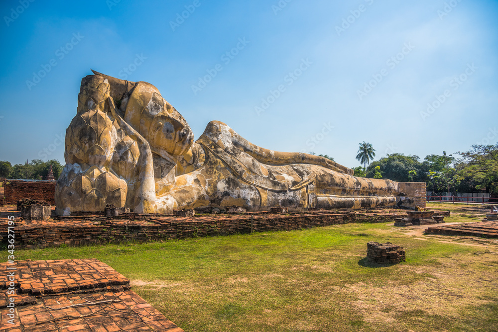 Lotus Flowers Supporting the Reclining Buddha's Head at Wat Lokaya Sutha, Phra Nakorn Sri Ayutthaya, Thailand. UNESCO World Heritage Site.