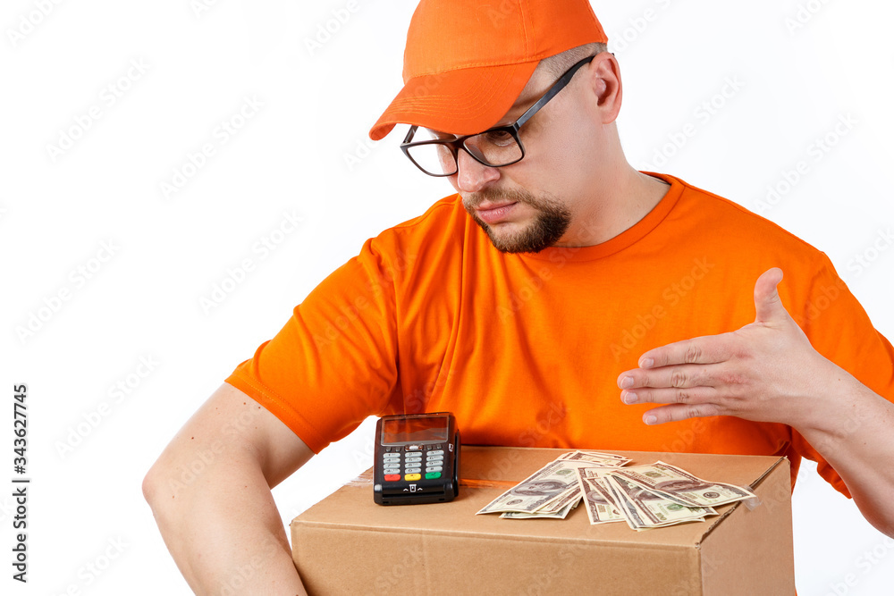 Friendly young man from a courier delivery service holds big boxes in his hands and a terminal for cashless payment on a white background Friendly young man from a courier delivery service holds big boxes in his hands and a terminal for cashless payment on a white background