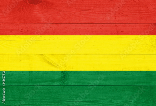 Bolivia flag painted on wooden wall for background.