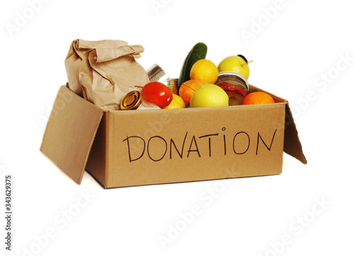 Various food  in a cardboard donation box, isolated