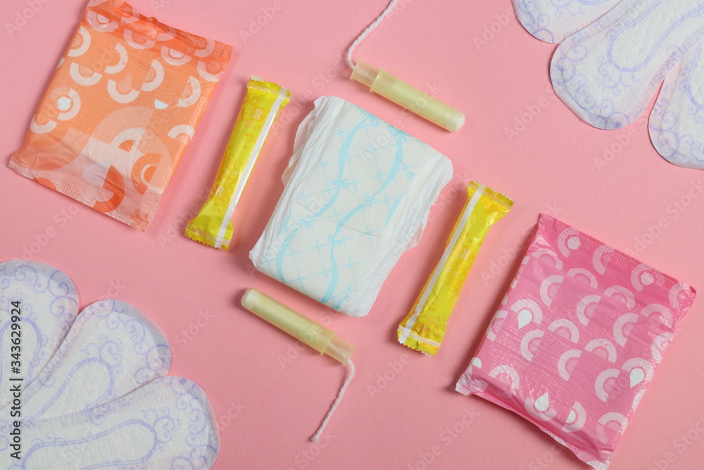 Pink and blue, pink background and women's pads with tampons. Pink and blue, pink background and women's pads with tampons.