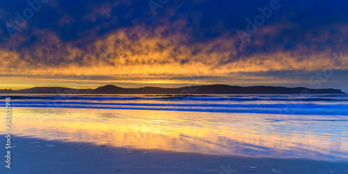 Stratocumulus Cloud Covered Sunrise Seascape © Merrillie