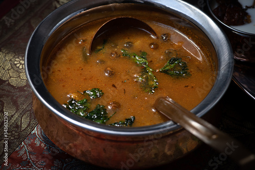 South Indian turkey berry gravy in traditional servingware photo