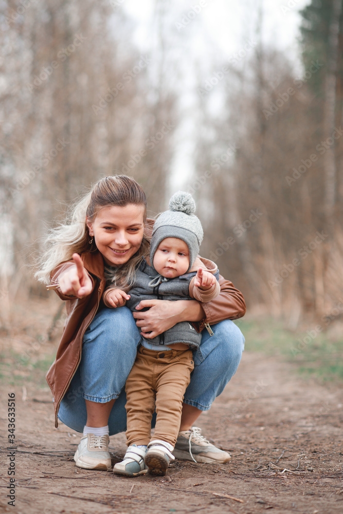 Mom and son walking in a park