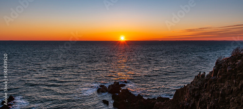 Foto Sunset over the Atlantic Ocean
