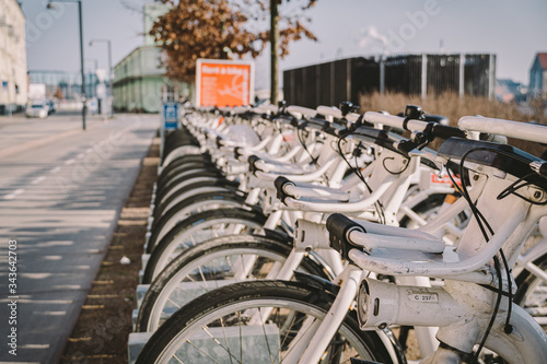 Bycyklen. Electric rental bikes in Copenhagen. row of Bycyklen bicycles. Public electric bikes for rent parked in Copenhagen, Denmark. Save CO2. e-bikes located in shared parking