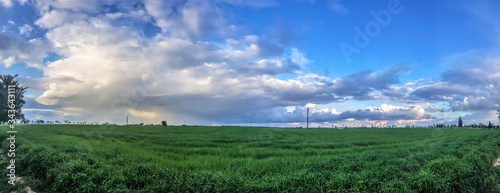 storm over crop fields in spain
