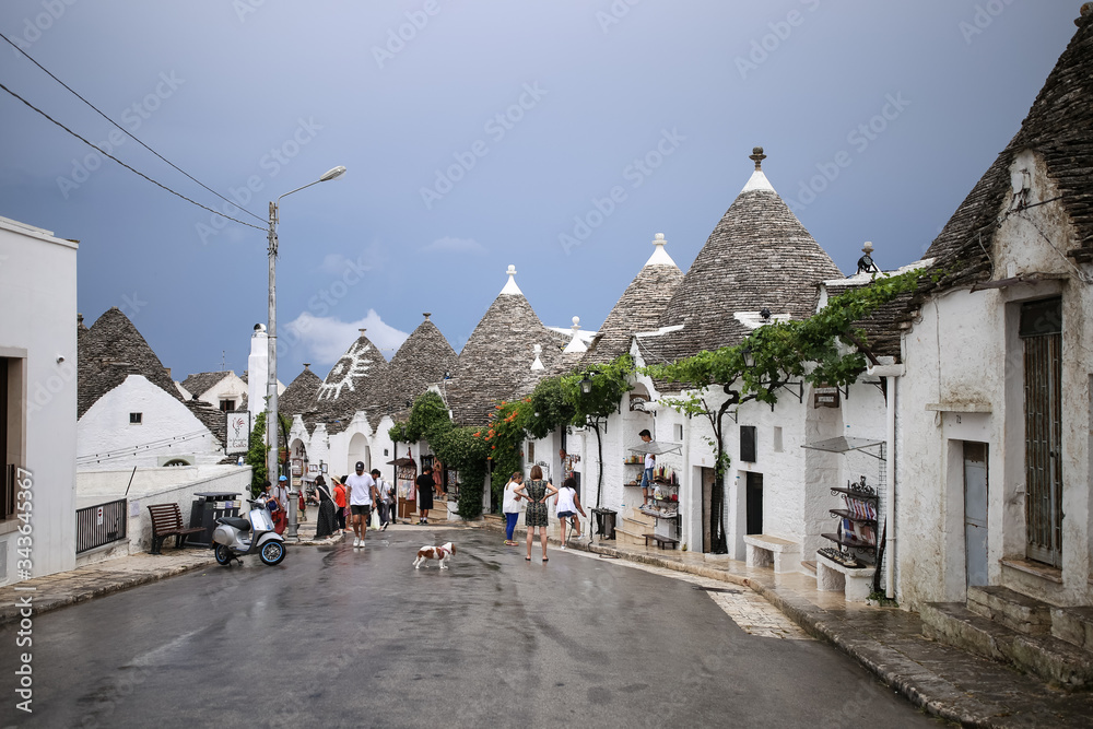 The beautiful white yards with a special houses of Alberobello in the southern part of Italy near Bari