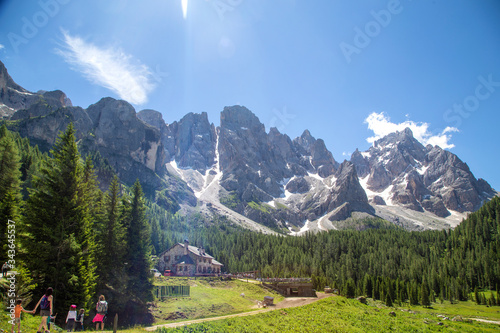 trekking in Val Venegia. In the background great view of the Pale di San Martino Dolomites Italy