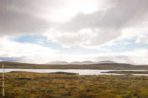 Wide Open Scottish Highland Bog Landscape with Loch and Distant Mountains in Sutherland