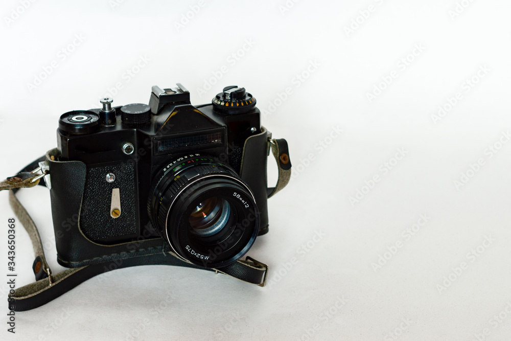 Old vintage film camera on a white background, isolate.