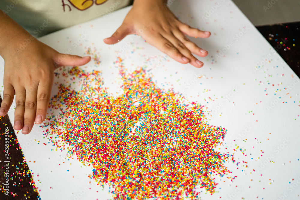 Playing with the colourful sugar sprinkles. Fun activites for children. Fine motor skills.