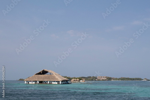 tropical beach with a hut © Melquisedec