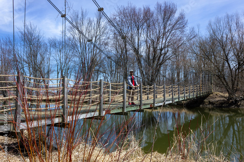 tourist man suspension bridge of Plaisance ,municipality in Papineau Regional County Municipality in western Quebec, Canada photo