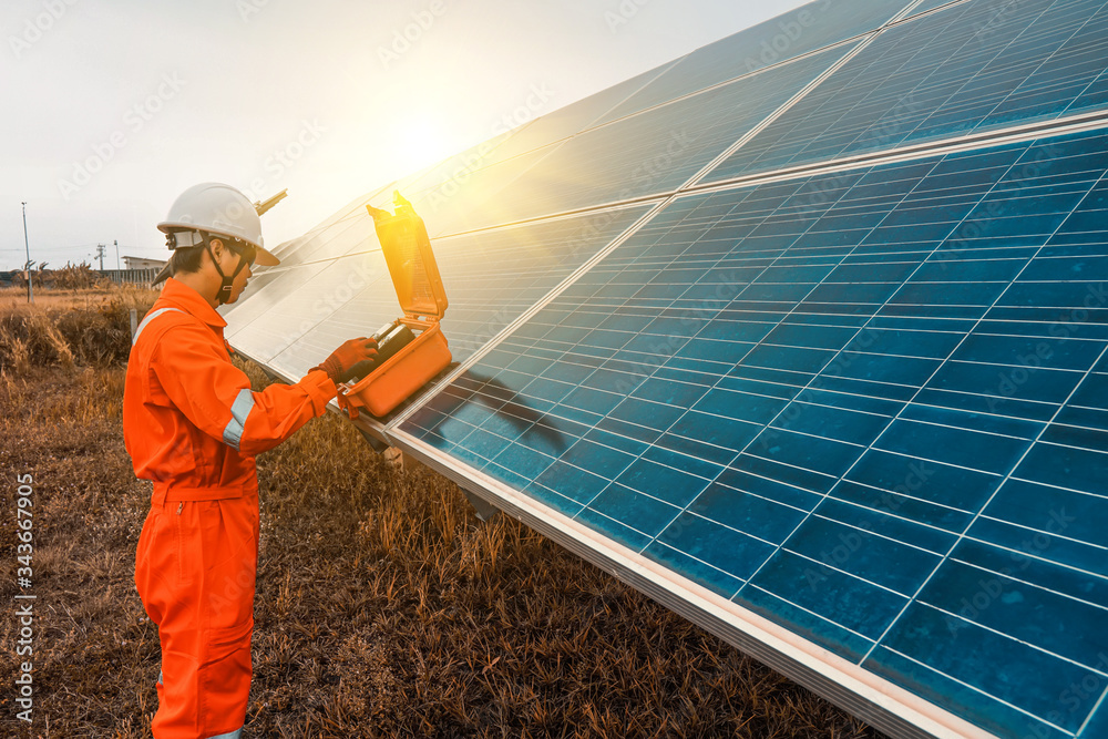 Engineers used a tool for checking the performance of the solar panel to confirming systems working normally. Photovoltaic module idea for clean energy production Engineers used a tool for checking the performance of the solar panel to confirming systems working normally. Photovoltaic module idea for clean energy production