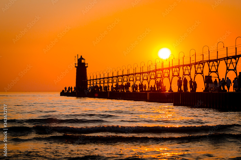 South Haven's lighthouse and pier on Lake Michigan during sunset