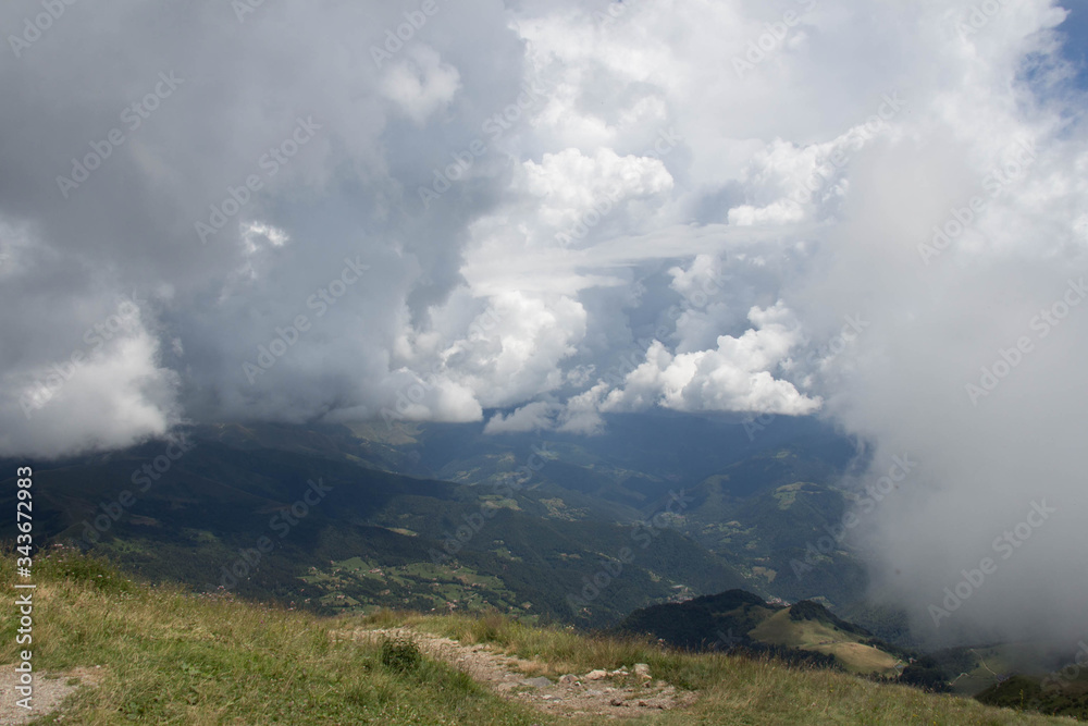 Thick rainy clouds above mountains lanscape in summer time. Thick rainy clouds above mountains lanscape in summer time.