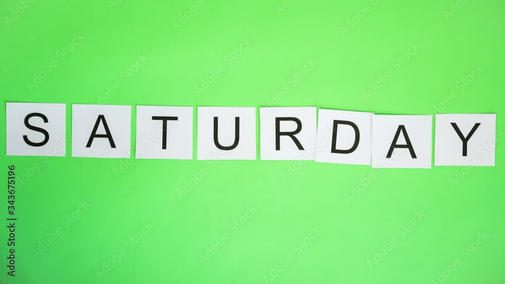 Cards with letters on greenscreen. Timelapse. Word SATURDAY
