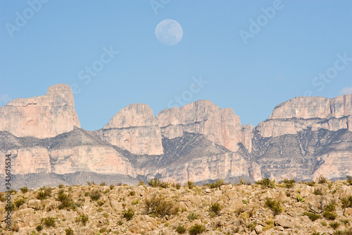 Moonrise over mountains in Big Bend National Park