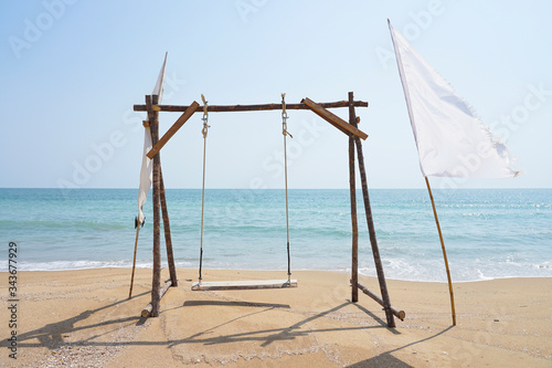 Wooden Swing & Hang Chair on the Beach.
