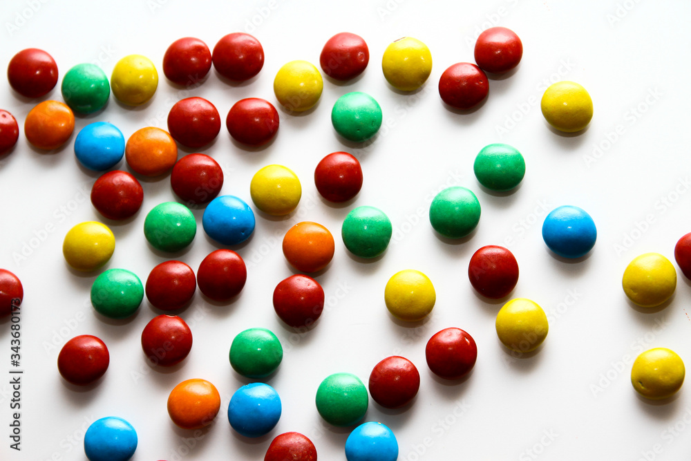 Colorful milk chocolate on white background Colorful milk chocolate on white background