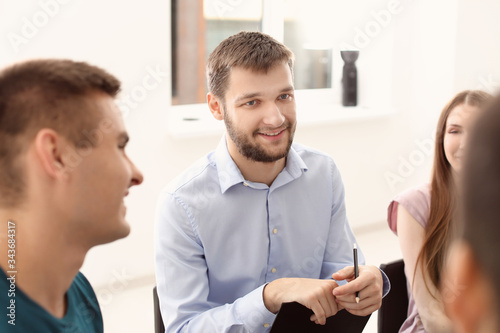 People at group therapy ses...