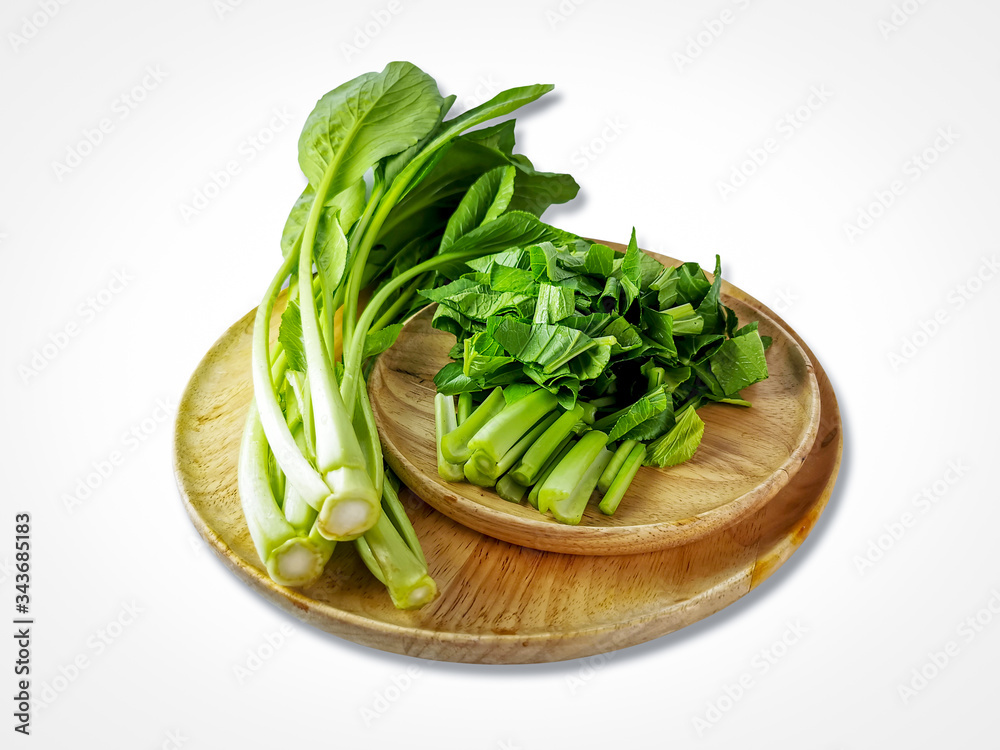 Fresh Cantonese vegetables and Slide into pieces in a wooden tray Fresh Cantonese vegetables and Slide into pieces in a wooden tray