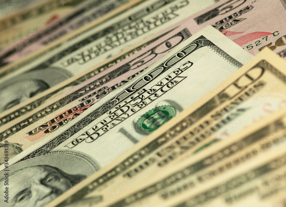 Colorful background with money US dollars of different value. Top view of business concept with finance for banks. American banknotes 5, 10, 50, 100 dollars backdrop Colorful background with money US dollars of different value. Top view of business concept with finance for banks. American banknotes 5, 10, 50, 100 dollars backdrop