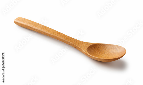 Wooden spoon placed on a white background