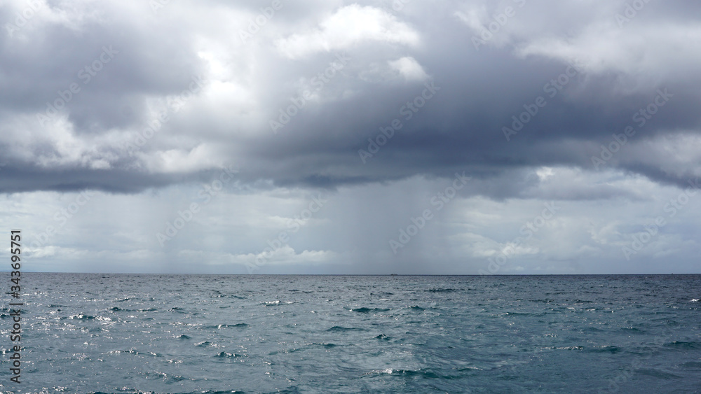 Heavy strom and rains from the sky into the open ocean outdoor